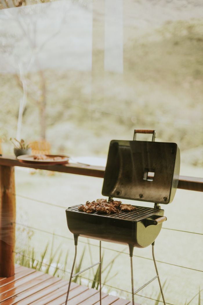 about-03 Juicy steaks sizzling on a backyard barbecue grill during summer.